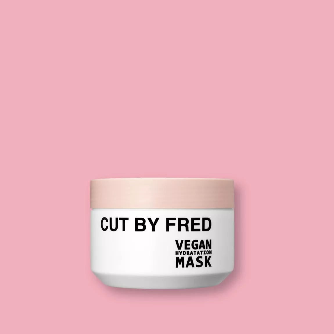 Vegan Hydratation Mask Cut By Fred, pot de masque capillaire hydratant sur fond rose.