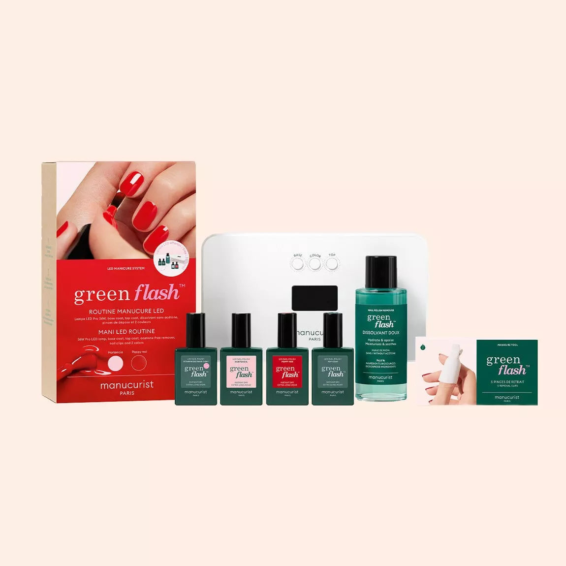 Contenu du kit Green Flash Manucurist : lampe LED blanche, vernis, base coat, top coat, dissolvant doux et accessoires sur fond beige