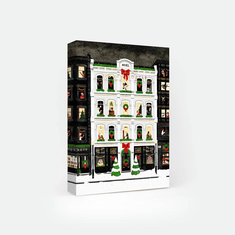 Boîte du puzzle Christmas London 1000 pièces All The Ways To Say, illustrée d’une façade londonienne enneigée et illuminée, ambiance magique de Noël.