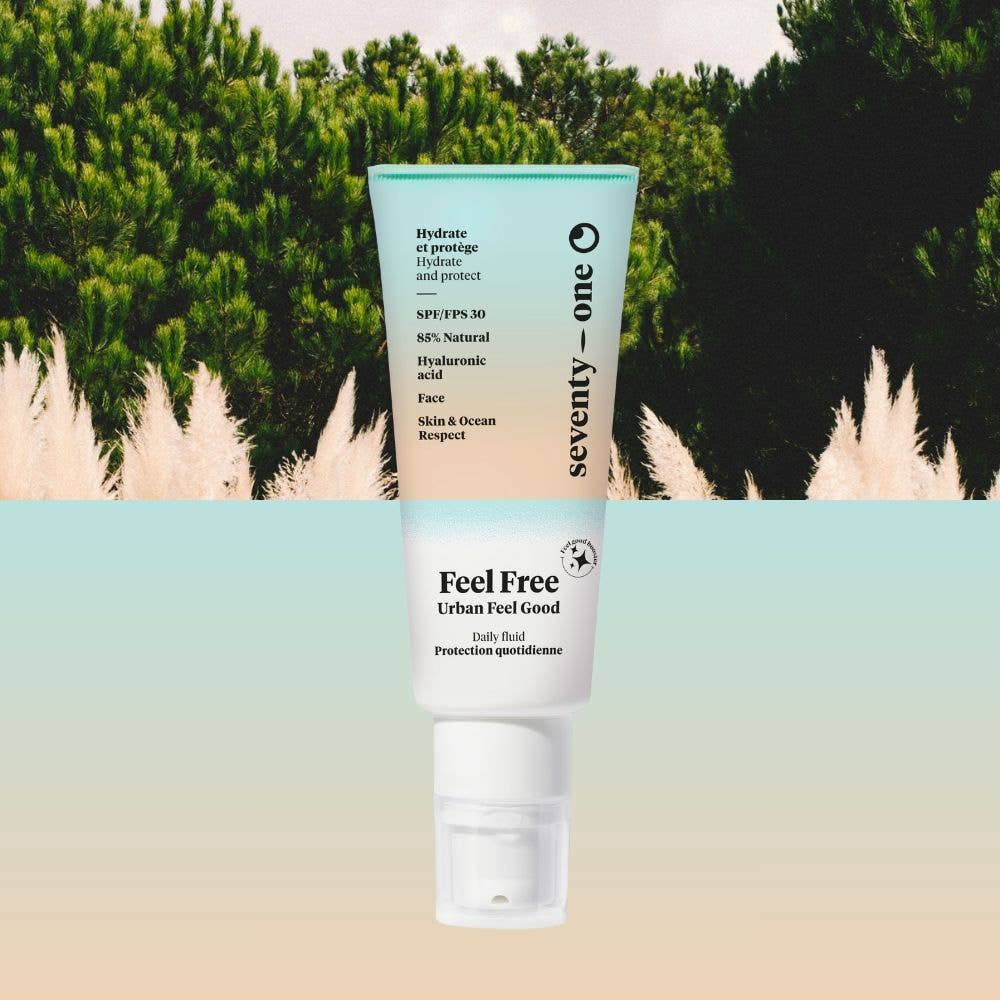 Fluide Visage SPF30 Feel Free Seventy-One présenté dans un décor inspiré de la nature, offrant une protection solaire quotidienne tout en hydratant la peau.